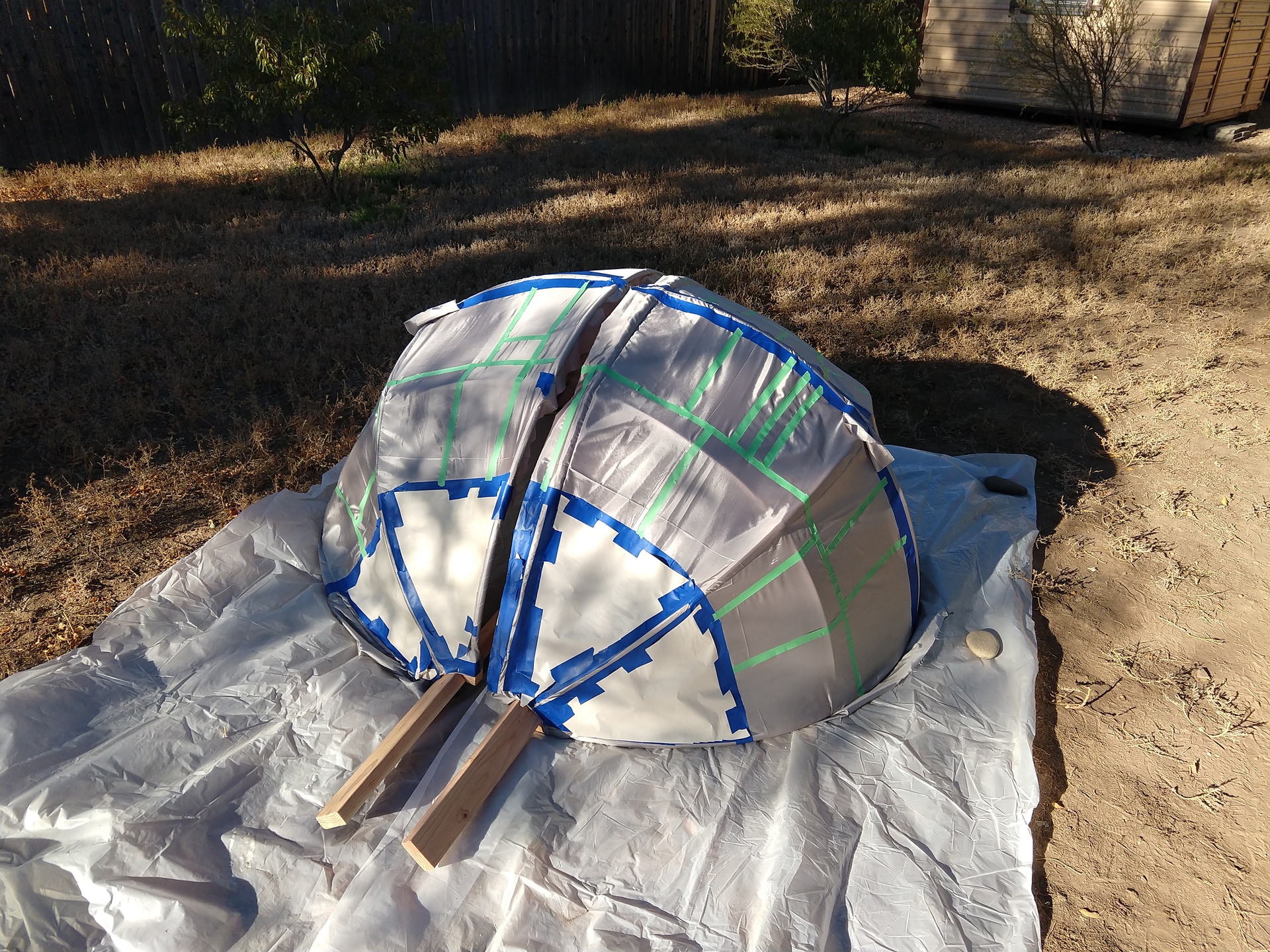 The fabric-covered frame masked and ready to be painted