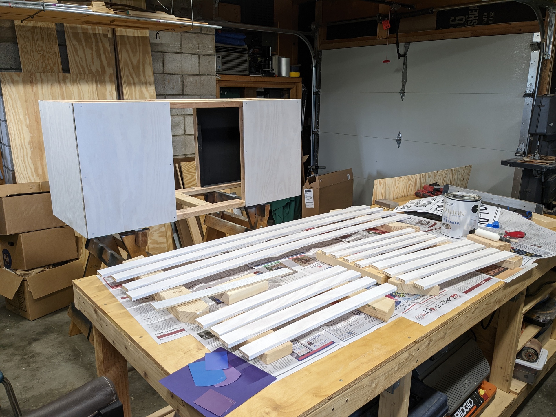 It sure took a lot of pieces to make a simple box The box with sides on it and trim pieces ready to be painted