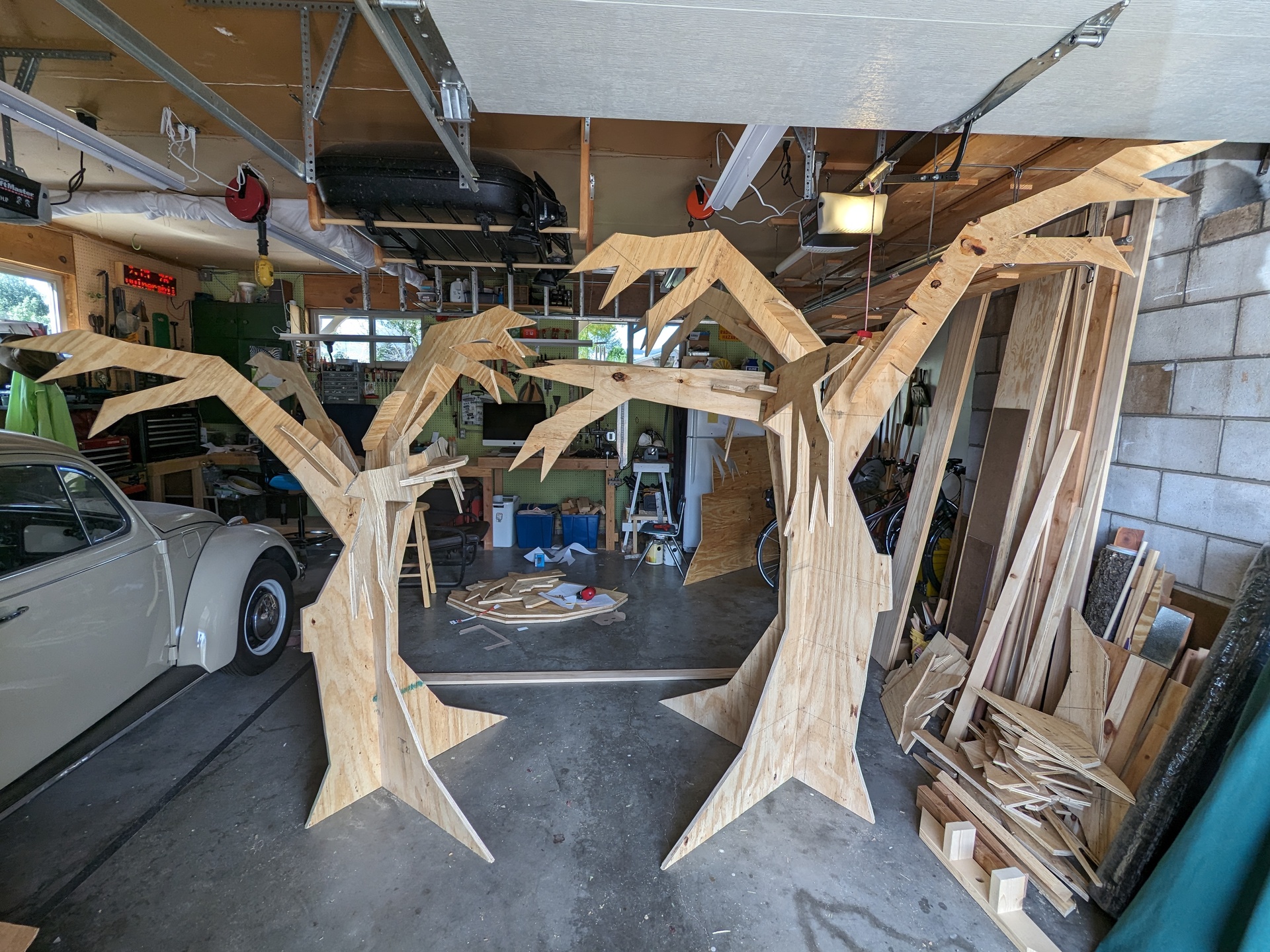Two complete trees, unpainted, taking up one side of the garage